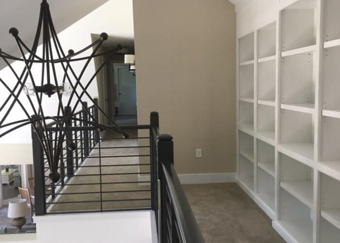 carpeted floor with white walls and ceiling